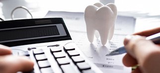 A patient calculating the cost of their dental treatment