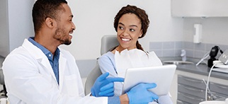 Dentist discussing cost of dental implants in Allentown with a patient