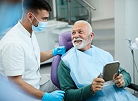 Man smiling at dentist during checkup