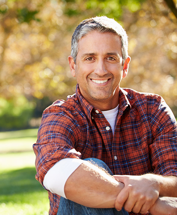 man in plaid smiling