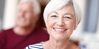 women smiling in striped shirt