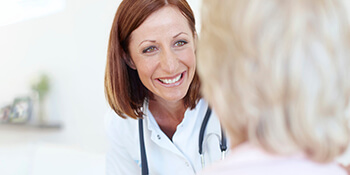 dentist looking at patient