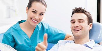 man with dentist doing thumps-up