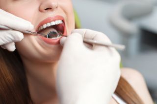 Woman getting a dental exam