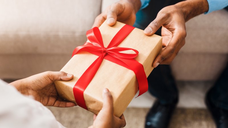 person giving teeth whitening as a gift