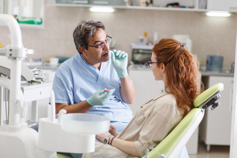 Dentist talking with their patient about dental emergencies